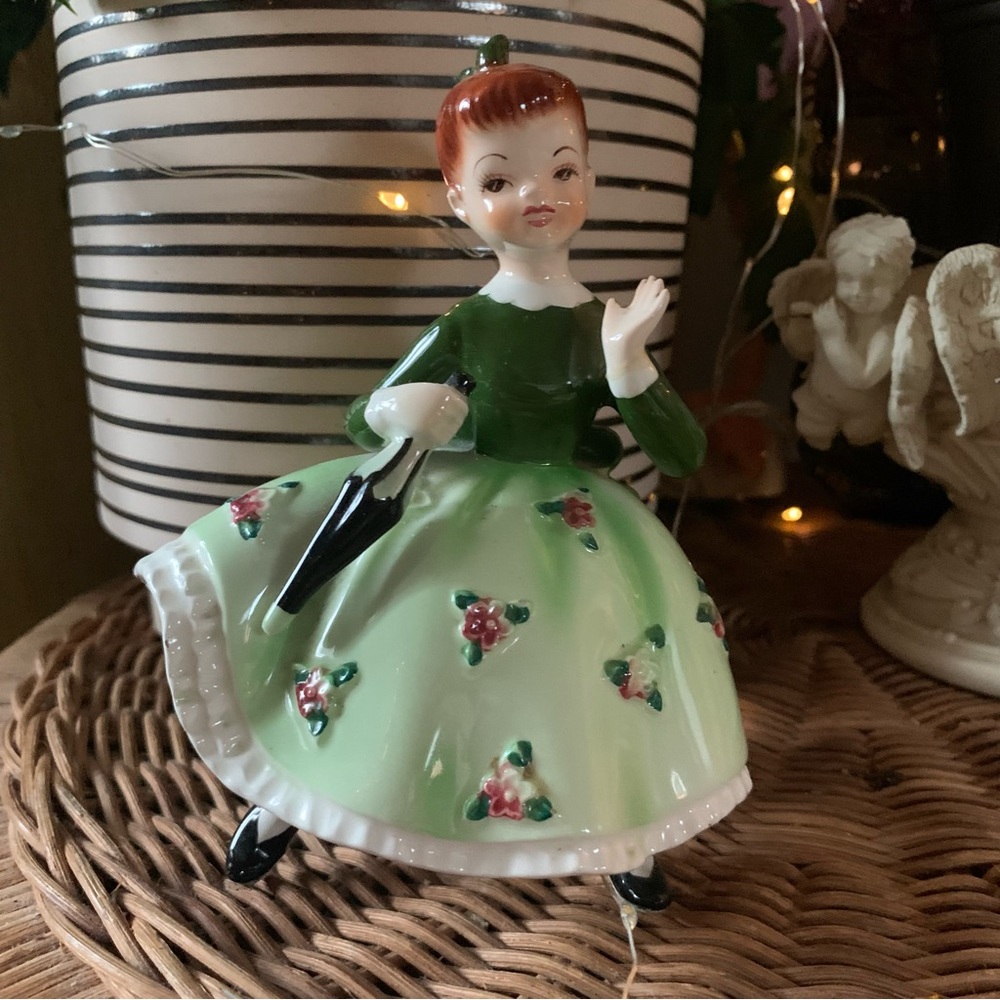 Vintage Orion Girl in green dress with umbrella figurine